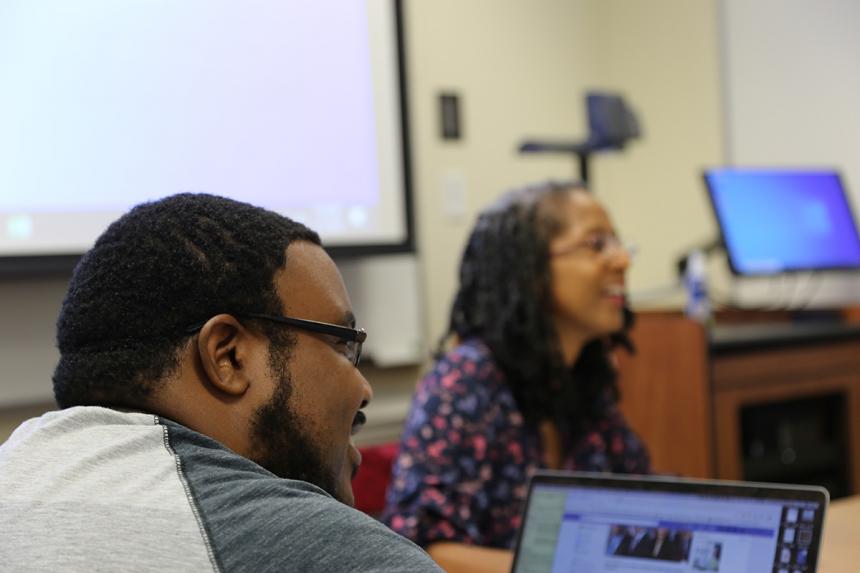 Student listening to Dr. Feracho.