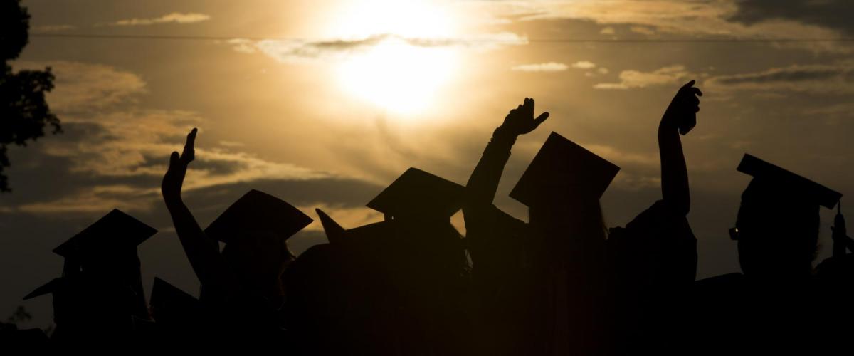 UGA Graduation caps at sunset