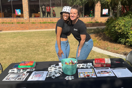Layla Greenwood and Chera Jo Watts promote AFAM courses and programs outside of the UGA Bookstore